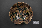 Bowl, Earthenware; buff slip, underglaze painted in black slip and polychrome pigments under transparent glaze