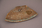 Waster, Earthenware; gritty yellowish body under blue glaze