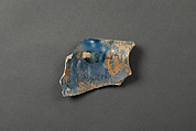 Fragment of a Bowl, Earthenware; white gritty body, molded decoration under dark blue glaze