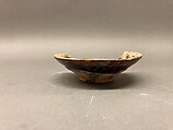 Bowl, Earthenware; black slip, decoration in white, yellowish glaze