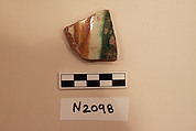 Ceramic Fragment, Earthenware; white slipped,incised and splashed under a colorless glaze