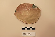 Ceramic Fragment, Earthenware; white slipped, with a green glaze.