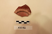 Ceramic Fragment, Earthenware; red slipped under a colorless glaze