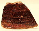 Fragment of a Bowl, Earthenware; gritty reddish body, white slip, sgraffito decoration under brownish yellow glaze