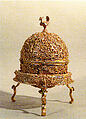 Goa Stone and Gold Case, Container: gold; pierced, repoussé, with cast legs and finials
Goa stone: compound of organic and inorganic materials