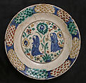 Dish, Stonepaste; underglaze painted in black, blue, and green with red and yellow slips