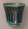 Beaker, Stonepaste; incised decoration through black slip under turquoise glaze.