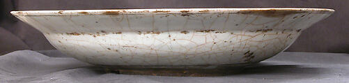 Dish, Stonepaste; underglaze painted in black, blue, and green with red and yellow slips