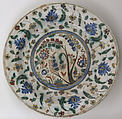 Plate, Stonepaste; underglaze painted in black, blue, and green with red and yellow slips