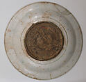 Plate, Stonepaste; underglaze painted in black, blue, and green with red and yellow slips