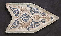 Tile, Stonepaste; molded, applied siliceous relief, in-glaze and overglaze-painted, over opaque white glaze