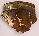 Fragment of a Dish, Earthenware; gritty body, brown and yellow streak decoration under glaze