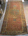 Carpet, Cotton (warp and weft), wool (pile); asymmetrically knotted pile 