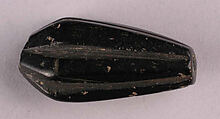 Bead, Black stone, probably jet; cut and drilled