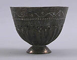 Cup and Holder, Cup: Porcelain; glazed and gold painted
Holder: Silver; repoussé
