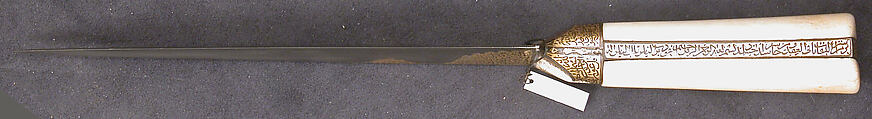 Knife with an Ivory Handle and Qur'anic Inscriptions, Hilt: walrus ivory
Blade: watered steel; gold inlay