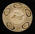 Bowl depicting a Man holding a Cup and a Flowering Branch, Earthenware; luster-painted on opaque white glaze