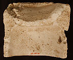 Fragment of a Base with Pair of Peacocks flanking a Palm Motif, Stucco; molded