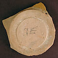 Base of a Vessel with a White Slip Inscription, Earthenware; red slip with polychrome slip decoration under transparent glaze
