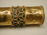 Hair Ornament, One of a Pair, Gold; cast, fabricated, engraved, with a copper alloy inner sleeve, decorated with twisted wire and granulation