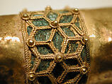 Hair Ornament, One of a Pair, Gold; cast, fabricated, engraved, with a copper alloy inner sleeve, decorated with twisted wire and granulation