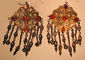 Pair of Floral Pectoral Ornaments, Silver, fire gilded and engraved/punched, stamped and bead decoration with openwork, twisted silver wire chains and pendants with appliques, table cut carnelians and turquoise beads