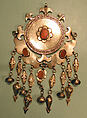 Pectoral Disc Ornament, Silver, with decorative wire, embossed pendants, ram's-head terminals, loop-in-loop chains, conical bells, and table-cut carnelians