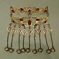 Dorsal Headdress Ornament, Silver with gilt applied decoration, embossed decoration, table cut carnelians, loop-in-loop chains, and bells
