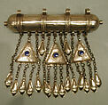 Amulet Holder, Silver; gallery wired and twisted wire decoration with glass stones, silver link chains and embossed pendants.