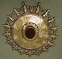 Pectoral Disc Ornament, Silver; fire-gilded and chased with rams head terminals, decorative wire and table cut carnelian