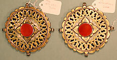 Pectoral Disc Ornament, One of a Pair, Silver; fire-gilded with stamped bead and twisted wired decoration, engraving/punching and openwork decoration and table cut carnelian