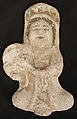 Seated tambourine player, Stucco; molded and painted