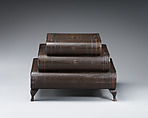 Graduated, three-tiered, footed box in book form