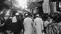 When All Roads Are One, Ghiora Aharoni (American, born Rehovot, Israel 1969), Single-channel digital video, black-and-white, 7 min., 46 sec.; gilded taxi meter, pedestal and vitrine