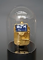 When All Roads Are One, Ghiora Aharoni (American, born Rehovot, Israel 1969), Single-channel digital video, black-and-white, 7 min., 46 sec.; gilded taxi meter, pedestal and vitrine