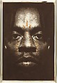 Man Spirit Mask, Willie Cole (American, born Newark, New Jersey, 1955), Left panel: Photo-etching, embossing and hand coloring
Middle panel: silkscreen with lemon juice and scorching
Right panel: photo etching and woodcut