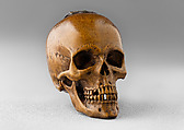 Prayer Bead in the Form of a Skull with the Entry into Jerusalem and the Carrying of the Cross, Fruitwood, German (?)