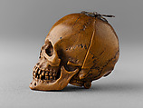 Prayer Bead in the Form of a Skull with the Entry into Jerusalem and the Carrying of the Cross, Fruitwood, German (?)