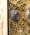Panel with Byzantine Ivory Carving of the Crucifixion, Silver-gilt with pseudo-filigree, glass, crystal, and sapphire cabochons, ivory on wood support, Byzantine (ivory); Spanish (setting)