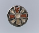 Disk Brooch, Silver, gilded and beaded filigree; garnets with patterned foil backings; central cabochon and tear-drop inlaid lost; no spring/pin extant, Frankish