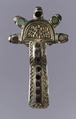 Bow Brooch, Silver, gilt and cast; garnet with unpatterned foil backing; bone; iron spring/pin, Frankish