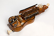 Hurdy gurdy, Ivory, paste, tortoise shell, brass, silver, lacquer, carving, purfling, eding, turning<br/>Sycamore body, carved and turned ivory, other parts of turtle shell inlaid with silver and brass piqué work (some turtle shell lacquered with silver and brass piqué work), silver roses, and partly silvered brass keys inset with faceted rock crystal and engraved mother-of-pearl, French