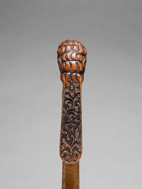 Hand-carved instrument head, a detail of traditional craftsmanship
