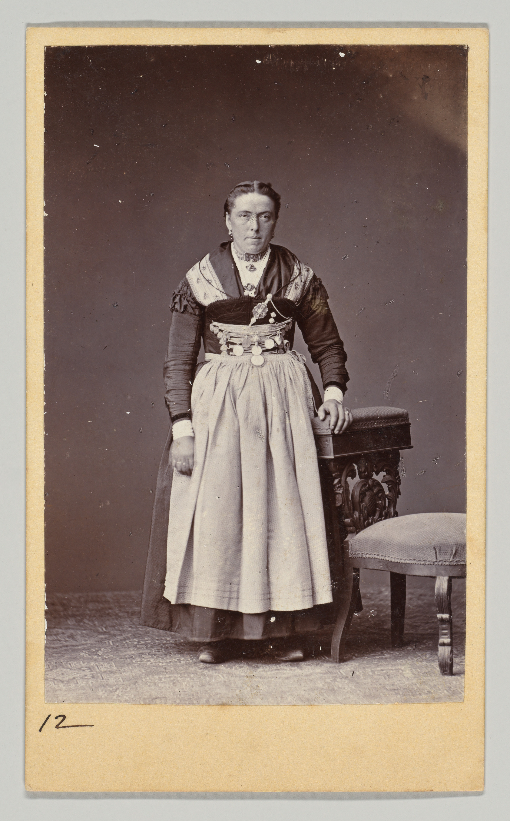[Woman in Regional Dress, Seen From Front and Back]