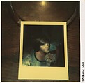 [Polaroid #921 on Desk: Glenn Ives (?) in Bed with Cat], Walker Evans  American, Instant internal dye diffusion transfer print (Polaroid SX-70)