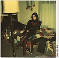 [Carla Steiger Seated on Her Bed, Oberlin, Ohio], Walker Evans  American, Instant internal dye diffusion transfer print (Polaroid SX-70)