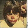 [Child in Clown Makeup: Tartan Jacket], Walker Evans  American, Instant internal dye diffusion transfer print (Polaroid SX-70)