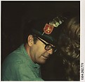 [Norman Ives in Feathered Cap at Dinner Party], Walker Evans  American, Instant internal dye diffusion transfer print (Polaroid SX-70)