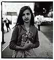 Child selling plastic orchids at night, N.Y.C., Diane Arbus  American, Gelatin silver print