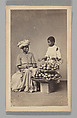[Studio Portrait: Seated Woman and Standing Boy Street Vendors with Vegetable Baskets, Brazil], Christiano Junior (Portuguese, active Argentina, 1832–1902), Albumen silver print